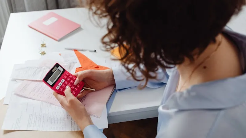 calculator and budget planning documents for apartment renovation